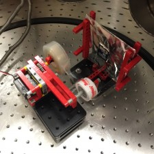 Tape dispenser and phosphor screen setup within the vacuum chamber